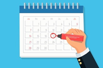 Datum auf einem Kalenderblatt wird rot mit einem Stift umkreist